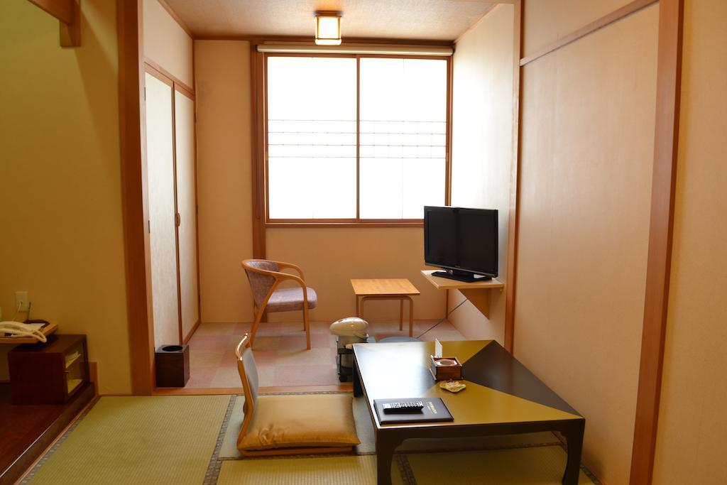 Akita Onsen Plaza Hotel Стая снимка