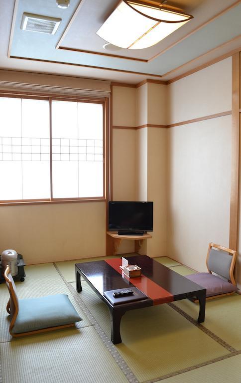 Akita Onsen Plaza Hotel Стая снимка